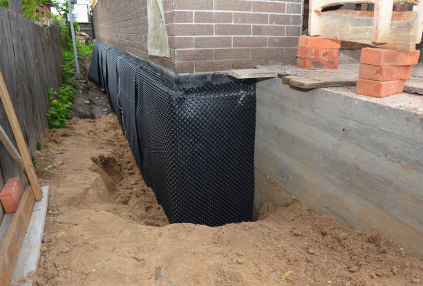 SJ Waterproofing Pros technician performing targeted Interior Drainage System assessment in Silverhill, AL